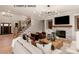 Spacious living room with a staircase, fireplace, hardwood floors, and stylish decor, offering a warm and inviting atmosphere at 11016 Tyler Brook Ln # Oak0036, Mint Hill, NC 28227