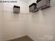 Unfurnished walk-in closet features wire shelving and carpeting at 11016 Tyler Brook Ln # Oak0036, Mint Hill, NC 28227