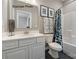 Bathroom features a patterned shower curtain, geometric floor tiles, and modern sink at 11020 Tyler Brook Ln # Oak0035, Mint Hill, NC 28227