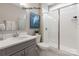 Elegant bathroom featuring a walk-in shower and gray vanity with double sinks at 11020 Tyler Brook Ln # Oak0035, Mint Hill, NC 28227