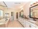 Luxury bathroom with soaking tub, glass shower, granite countertops, and vanity area at 11020 Tyler Brook Ln # Oak0035, Mint Hill, NC 28227