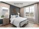 Beautiful bedroom featuring neutral tones, decorative wall art, and a bright window view at 11020 Tyler Brook Ln # Oak0035, Mint Hill, NC 28227