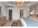 Spacious bedroom featuring a decorative tray ceiling and plenty of natural light at 11020 Tyler Brook Ln # Oak0035, Mint Hill, NC 28227