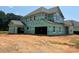 New home construction featuring framed garage and house wrap awaiting further detailing at 11020 Tyler Brook Ln # Oak0035, Mint Hill, NC 28227