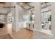 Open dining room with wood flooring, statement columns, and natural light throughout the space at 11020 Tyler Brook Ln # Oak0035, Mint Hill, NC 28227