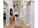 Bright foyer with high ceilings, hardwood floors, decorative mirror and hallway leading to rooms at 11020 Tyler Brook Ln # Oak0035, Mint Hill, NC 28227