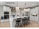 Modern kitchen with white cabinetry, stainless steel appliances, and a large central island at 11020 Tyler Brook Ln # Oak0035, Mint Hill, NC 28227