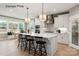 Bright, stylish kitchen featuring a large island, white cabinets, and stainless steel appliances at 11020 Tyler Brook Ln # Oak0035, Mint Hill, NC 28227