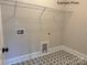 Bright laundry room with star patterned floors and white trim at 11020 Tyler Brook Ln # Oak0035, Mint Hill, NC 28227