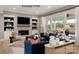 Cozy living room featuring a fireplace, built-in shelves, comfortable seating, and an open patio at 11020 Tyler Brook Ln # Oak0035, Mint Hill, NC 28227