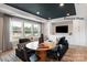 Entertaining space with custom cabinetry, modern television, and statement lighting fixtures at 11020 Tyler Brook Ln # Oak0035, Mint Hill, NC 28227