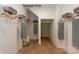 Well-organized walk-in closet with wooden hangers, shelves, and ample storage space at 11020 Tyler Brook Ln # Oak0035, Mint Hill, NC 28227