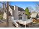 A spacious backyard deck with white railings and stairs leading to the yard at 11121 Timber Hill Ct, Charlotte, NC 28226