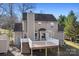 A spacious backyard deck with white railings and stairs leading to the yard at 11121 Timber Hill Ct, Charlotte, NC 28226