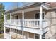 Detailed view of the home's double balconies, showcasing the architectural design and outdoor living space at 11121 Timber Hill Ct, Charlotte, NC 28226