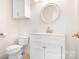 Cozy bathroom with white vanity, round mirror, and tiled floor at 11121 Timber Hill Ct, Charlotte, NC 28226