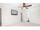 Bedroom with neutral carpet, ceiling fan, TV, and access to other areas at 11121 Timber Hill Ct, Charlotte, NC 28226