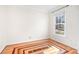 Bedroom featuring hardwood floors and a bright window at 11121 Timber Hill Ct, Charlotte, NC 28226