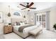 Bedroom with a ceiling fan, neutral decor, and a sliding door to a balcony for fresh air and natural light at 11121 Timber Hill Ct, Charlotte, NC 28226