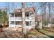 Charming two-story home featuring double balconies, a well-maintained yard, and inviting curb appeal at 11121 Timber Hill Ct, Charlotte, NC 28226