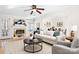 Bright and open living room with a fireplace, light colored walls, and modern furnishings at 11121 Timber Hill Ct, Charlotte, NC 28226