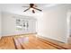 Bright living room featuring decorative hardwood floors and a large window at 11121 Timber Hill Ct, Charlotte, NC 28226