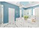 Modern bathroom with double sink vanity, and soaking tub in a room with striking blue walls at 11130 Mccamie Hill Pl, Concord, NC 28025