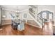 Elegant dining room with chandelier, wood floors, two-tone paint and staircase to the upper level at 11130 Mccamie Hill Pl, Concord, NC 28025