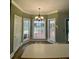 Bright breakfast nook featuring large windows and modern light fixture at 117 Pheasant Ridge Cir, York, SC 29745