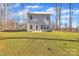 Large grassy backyard, featuring exterior of home and lots of sunlight at 120 Orville Rd, Statesville, NC 28677