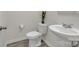 Small bathroom featuring a sleek pedestal sink, modern toilet, and neutral wall color scheme at 120 Orville Rd, Statesville, NC 28677
