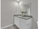 The bathroom has a granite countertop on a white cabinet and a large mirror at 120 Orville Rd, Statesville, NC 28677