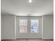 Bedroom with a large window providing natural light and hardwood floors at 120 Orville Rd, Statesville, NC 28677