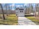 Charming two-story home featuring a manicured lawn and a spacious driveway at 120 Orville Rd, Statesville, NC 28677