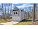 Exterior elevation of a charming home featuring a manicured lawn and a spacious driveway at 120 Orville Rd, Statesville, NC 28677