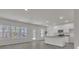 Bright kitchen with stainless steel appliances, white cabinets, and large windows overlooking the backyard at 120 Orville Rd, Statesville, NC 28677