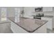 Spacious kitchen island featuring granite countertops, a stainless steel sink, and modern faucet, perfect for meal preparation at 120 Orville Rd, Statesville, NC 28677