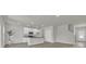 Bright, open-concept kitchen with white cabinets, stainless steel appliances, and a center island, perfect for entertaining at 120 Orville Rd, Statesville, NC 28677