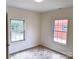 Bedroom with two windows providing natural light and decorative floors at 123 Oak St, Chester, SC 29706