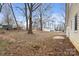 Expansive backyard with mature trees providing shade and privacy, perfect for outdoor activities and relaxation at 1275 Rocky Creek Rd, Shelby, NC 28152