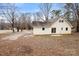 Spacious backyard featuring a well-maintained lawn and mature trees, offering privacy and tranquility at 1275 Rocky Creek Rd, Shelby, NC 28152