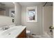 Bathroom featuring a shower/tub combo, a toilet, and a vanity with warm-toned wood cabinets at 1275 Rocky Creek Rd, Shelby, NC 28152