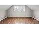 Bedroom in neutral tones featuring two windows and wood-look floors at 1275 Rocky Creek Rd, Shelby, NC 28152