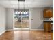 Dining room featuring a sliding glass door and views of the yard with wood-look flooring at 1275 Rocky Creek Rd, Shelby, NC 28152