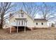 Charming two-story home with yellow siding and multiple decks, perfect for outdoor living and entertaining at 1275 Rocky Creek Rd, Shelby, NC 28152