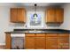 Close up of the kitchen featuring wood cabinets, dark countertops and a stainless steel sink at 1275 Rocky Creek Rd, Shelby, NC 28152