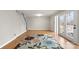 Open living room with hardwood floors and access to the outdoor deck at 1275 Rocky Creek Rd, Shelby, NC 28152