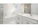 Bathroom with a soaking tub, double sink vanity, and separate shower at 130 Woodhall Way, Troutman, NC 28166
