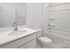 Bright bathroom with a single sink vanity, shower and bath at 130 Woodhall Way, Troutman, NC 28166