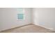 Bedroom featuring neutral carpeting and a window with blinds at 130 Woodhall Way, Troutman, NC 28166